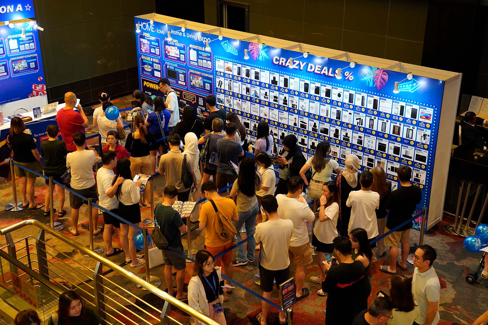 Shoppers exploring furniture at the Malaysian furniture fair.